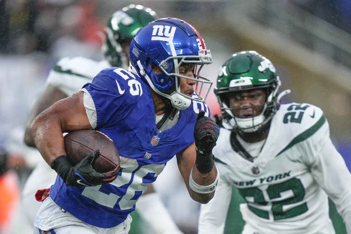 On Sunday, October 29, 2023, in East Rutherford, New Jersey, during the second half of an NFL football game against the New York Jets, running back Saquon Barkley (age 26) of the New York Giants touches the ball.