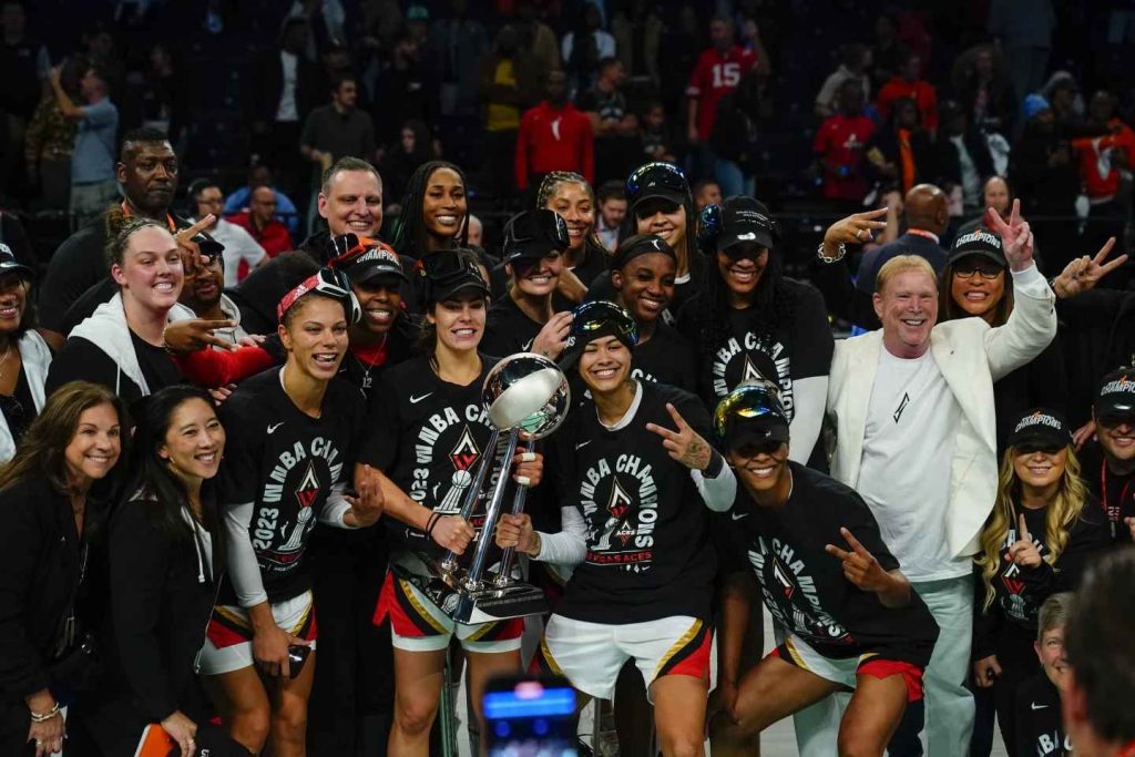 The Las Vegas Aces raise the trophy following Game 4 of their WNBA final playoff series against the New York Liberty on Wednesday, Oct. 18, 2023, in New York. The Aces triumphed 70-69.