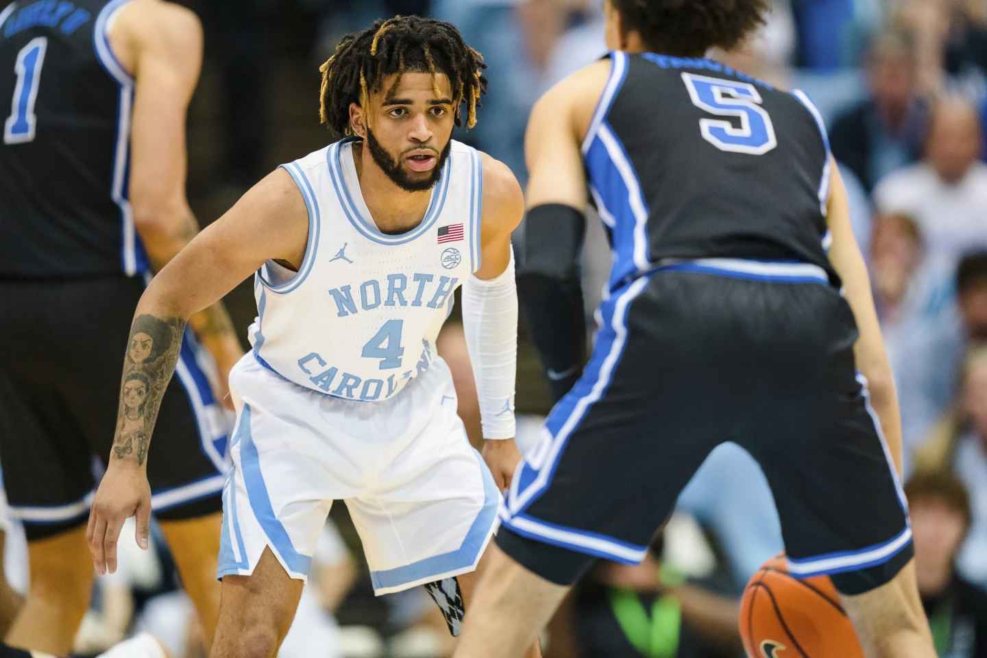 R.J. Davis (4) of North Carolina guard guards Duke guard Tyrese Proctor (5) of Duke during an NCAA college basketball game on March 4, 2023, in Chapel Hill, N.C. The North Carolina Tar Heels are placed 19th in the preseason Associated Press Top 25. (Photo by Chuck Burton, File)