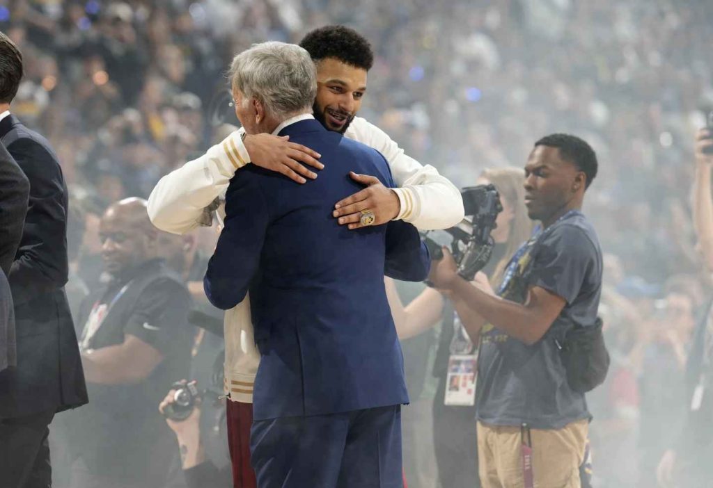 Denver Nuggets guard Jamal Murray, back, receives a hug from team owner Stan Kroenke before an NBA basketball game against the Los Angeles Lakers on Tuesday, Oct. 24, 2023, in Denver. (Photo by David Zalubowski)