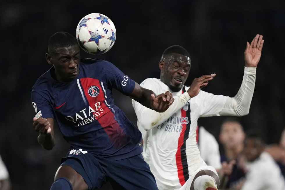 PSG's Randal Kolo Muani, left, competes for the ball with AC Milan's Fikayo Tomori during the Champions League group F soccer match between Paris Saint-Germain and AC Milan on Wednesday, Oct. 25, 2023, at Parc des Princes stadium in Paris. (Photo by Thibault Camus)