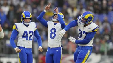 The Los Angeles Rams' Lucas Havrisik (8) celebrates a field goal against the Baltimore Ravens with Rams defender Michael Hoecht (97) and punter Ethan Evans (42) on Sunday, December 10, 2023, in Baltimore. It was the first half of an NFL game. (Alex Brandon took the picture)