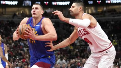 On Tuesday, December 12, 2023, in Chicago, Nikola Jokic of the Denver Nuggets goes to the basket past Nikola Vucevic of the Chicago Bulls. This happens during the first half of an NBA basketball game. (Google Photo credit)